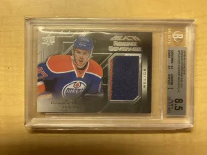 Connor McDavid 2015-16 Upper Deck Black Rookie Coverage Jersey BGS 8.5 front
