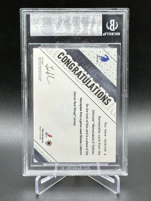 2002-03 Be A Pro Ultimate Memorabilia 3rd Edition Nicklas Lidstrom Nameplates 35 of 40 (SN#: 12115/25000) back