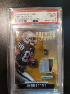 2015 Prizm Amari Cooper Preimer Jerseys Gold Psa 9 2/25 POP 1 front