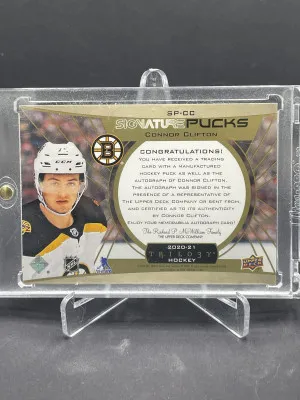 2020-21 UD Trilogy Gold Signature Pucks Connor Clifton Rookie Auto /21 back