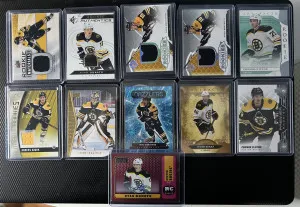 11 Card Boston Bruins Auto / Patch Lot. Brad Marchand, Jeremy Swayman and more. front