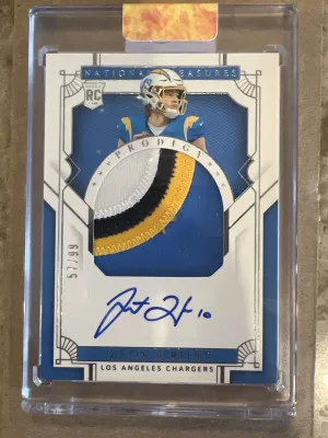 Justin Herbert National Treasures RPA /99 On Card Auto front