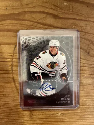 22-23 Skybox Metal Universe Lukas Reichel rookie auto 181/349 front