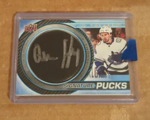 2022/23 Trilogy Quinn Hughes Signature Pucks Auto front