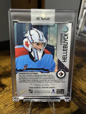 2023-24 UD Metal Universe Connor Hellebuyck PMG Green Auto /10 back