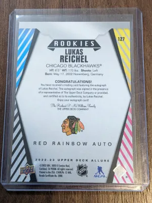 2022-23 Upper Deck Allure Red Rainbow Auto Rookies Lukas Reichel #127 Chicago back