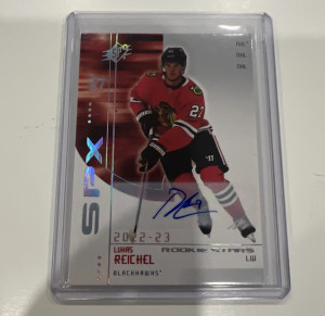 2022-23 Upper Deck SPX Lukas Reichel Blackhawks Auto 2002-03 Retro Rookies front