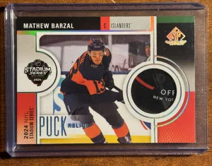 2024-25 SP Game Used Mathew Barzal Stadium Series Puck Relics #SSP-MB front