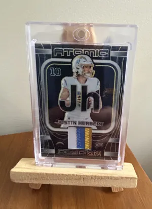 2023 Panini - Obsidian Justin Herbert #AMA-JHE (07/10) front