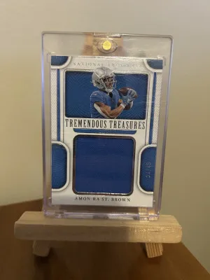 2022 Panini National Treasures Amon-Ra St. Brown #TRE-ASB (34/49) Tremendous Treasures front