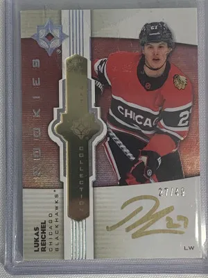 Lukas Reichel Ultimate Rookie Emblems Auto /49 Jersey # front