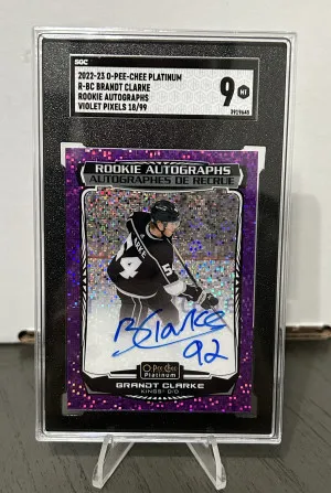 22-23 O-Pee-Chee Platinum Brandt Clarke Violet Pixels Rookie Auto /99 Graded SGC 9 front