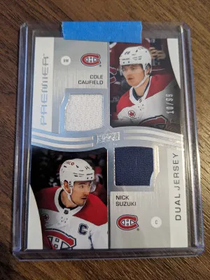 2023-24 UD Premier Dual Jersey Caufield/Suzuki (10/99) – Canadiens front