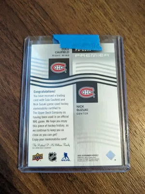2023-24 UD Premier Dual Jersey Caufield/Suzuki (10/99) – Canadiens back