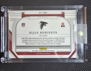 2023 National Treasures Bijan Robinson RPA #/99 On Card Auto back