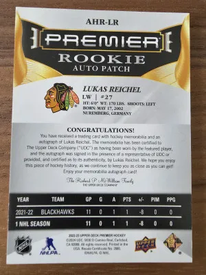 2022-23 Upper Deck Premier #AHR-LR Lukas Reichel Acetate Rookie Auto Patch 09/99 back