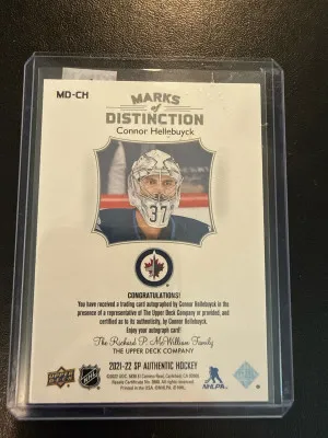2021-22 SP Authentic Marks Of Distinction Connor Hellebuyck /25 back