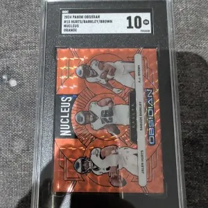 2024 Obsidian Brown/Hurts/Barkley Nucleus-Orange Mosaic SGC10 front