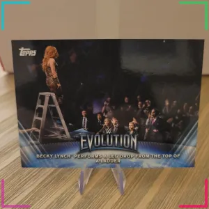 Becky Lynch Performs A One Leg Drop From The Top Of The Ladder Topps WE-9