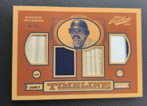 REGGIE JACKSON QUAD RELIC /25