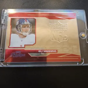 Eli Manning Prestigous Pros Red /750