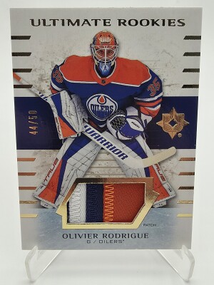 2025-26 ULTIMATE COLLECTION Olivier Rodrigue Ultimate Rookies Tri-Color Patch 44/49